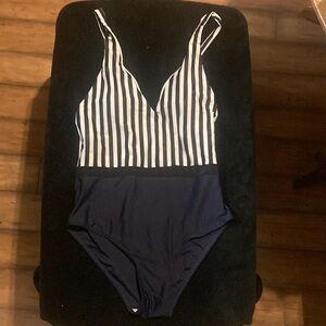 Size M women’s black and white striped one piece swimsuit